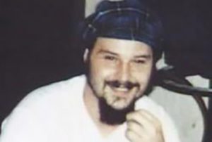 Brian Foguth, colored headshot, wearing a dark blue bandana on his forehead.