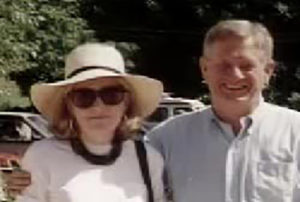 Susan Harrison with sunglass and a widebrim hat. Her ex-husband, Jim, has his arm around her.
