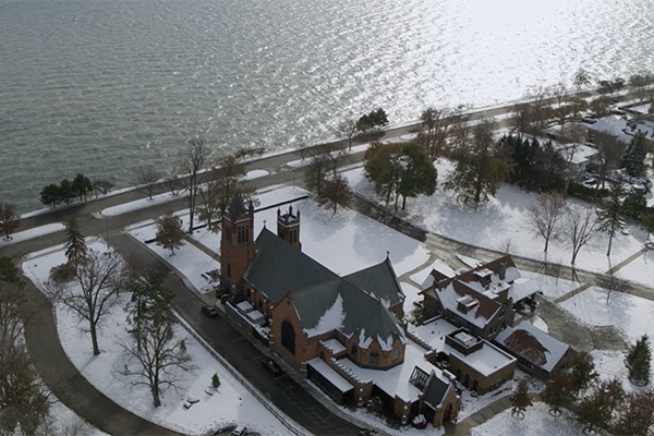 Aerial of church and lake, snow