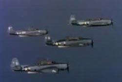 Four navy bombers in flight.