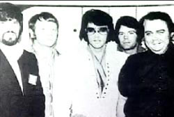 Elvis Presley standing next to four friends from Memphis