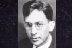 Headshot of Dr. Carl Austin Weiss, he is wearing wire rimmed glasses