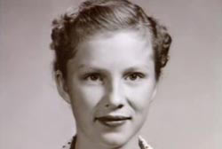 A young woman with her hair up in braids. 