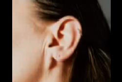 Close up on the earlobe of a brunette woman