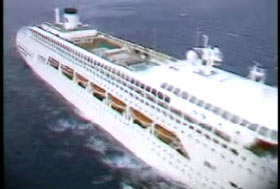 A white cruise ship out to sea.