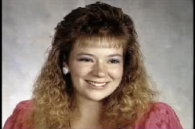 A young woman, Angela Hammond, with crimped blonde hair and pink dress.
