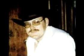 Lee 'Dub' Wackerhagen wearing a white shirt and cowboy hat.