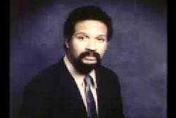 An african american man, Charles Southern, in a suit with a mustache and goatee.