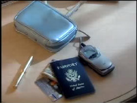 A light blue small purse is on a table with it's content laid out next to it: a cellphone, a passport, cash and credits cards, and a pen.