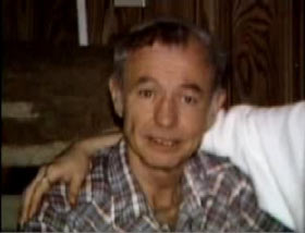 An elderly caucasian man with short grey hair wearing a grey plaid shirt, Dale Kerstetter.