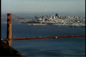 The golden gate bridge with the skyline of San Francisco in the background.