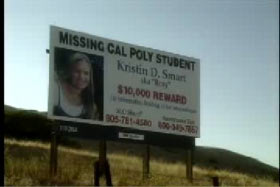 A billboard advertising a reward for information on Kristin Smart's whereabouts.