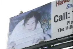 A billboard advertising that Sabrina is missing and a number to call.