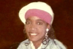A young African American woman, Selena Edon, wearing a pink and white hat.