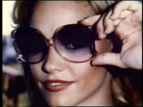 Tami Lynn Leppert posing with large sunglasses.