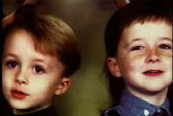Two young boys, Damon and Devon Routier. Damon has short blonde hair and Devon has short brown hair.