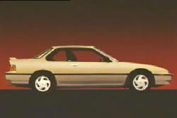 A pixelated image of beige two door compact car.