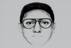 A composite sketch of a caucasian man with dark features and glasses