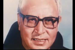 Smiling Fr. Reynaldo Rivera wearing glasses