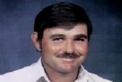 Smiling Larry Costine with a mustache