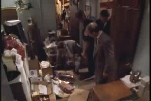 Investigators examining the back room of a store