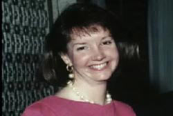 Smiling Lynn Amos with a pearl necklace