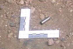 A .38 shell on the rocky floor of the crime scene