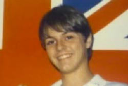 Smiling Matthew Chase with medium length hair