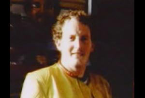 Smiling Michael Hunter in a yellow shirt 