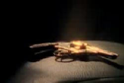 A bright golden light shining on a small revolver