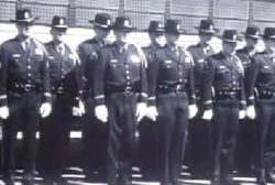 Many students standing at attention at a police academy