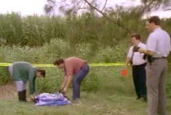 Search personel and police investigators finding Rebecca's body in a field