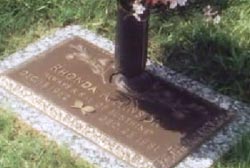 A bronze and stone commemorative gravesite for Rhonda Hinson