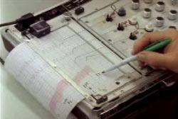A person analysing a polygraph test administered to Jim