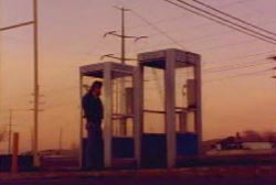 'Don' standing in a phonebooth in the desert