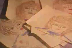 Child's drawings of a woman with brown hair