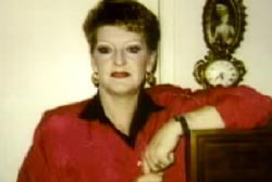 Psychic Etta Smith in a red and black shirt