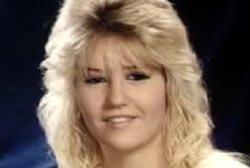 Smiling Kelly Ames with blond hair
