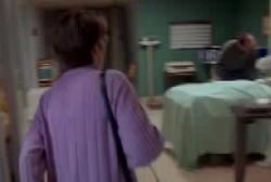 A woman rushing into a hospital room her son is in