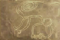 A large outline on the ground of what appears to be a monkey on the Nazca Plateau