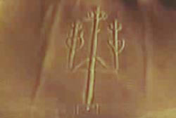 An abstract etching on the Nazca Plateau that is in the shape of a three pointed spear