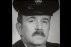 Mr. George Mott with a mustache in police uniform