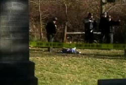 Police investigators looking over the lifless body of Jessica Keen in a cemetary