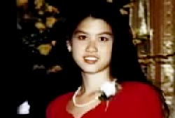Smiling Joyce Chiang in a red dress