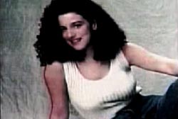 Chandra Levy smiling in a white tank top