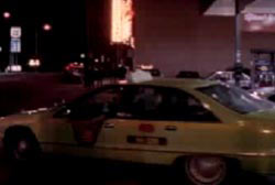 A taxi cab picking up Mia Zapata at night