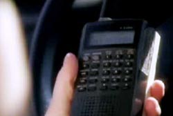 Pritchert holding a police scanner