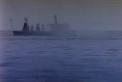 The silhouette a ship on a foggy horizon
