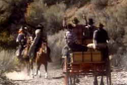 Plummers gang holding up a stagecoach at gunpoint