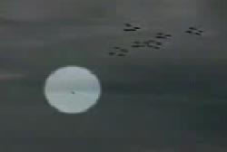 A similar round metallic unidentified flying object in the sky
